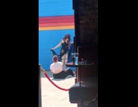 Woman black dress violet hair doorway pictorial