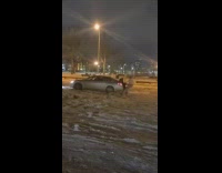 Guy in trunk pulls friend across snow 