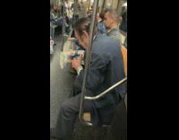 Man takes a swig of vodka on subway train and puts hishat back on his head #BluePointWhatTheL