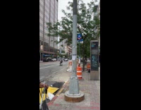 Collab WINY - Man rides chair with wheels on road