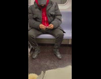 Guy cuts nails on train 