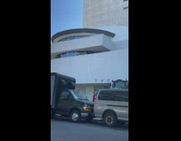 Inflatable grey mouse rat outside museum van