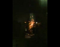 Man does welding on balcony 