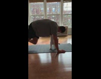 Dog plays with guy doing exercise workout