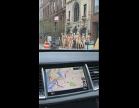 Large group of nude mannequins sidewalk GPS