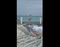 Woman in white bikini selfie on the dock pole