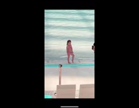 Young girl pose at pool waterpark chairs