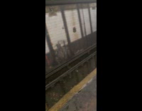 Rain pour and floods subway train tracks