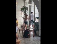 Couple twirl video at the restaurant entrance