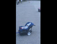 Toy car pulls baby in car seat 