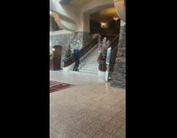 Girl shirt bag look behind pose stairs