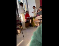 Woman red top assisted for restaurant video