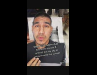 Guy shows picture of his picture printed on paper 