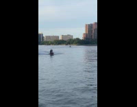 Man Joker costume rides jet-ski on river