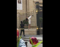 Woman white dress hang on gate fence