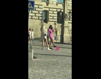 Pink dress girl lifts one leg up 