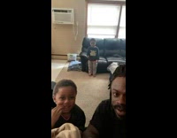 Dad and son react to son getting hit in face with football