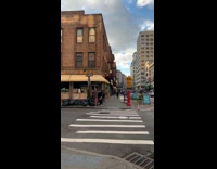 Guy holds rat costume mask while talking 