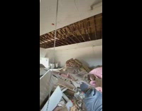 Guy falls from ceiling pile of trash