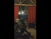 Guy jumps from couch ping pong table 