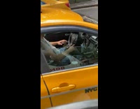 Taxi driver play with mobile app street