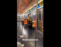 Man wear Pikachu ski mask inside train