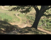 Guy rides bicycle down dirt hill fail 
