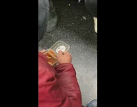 Guy eats salsa with lid on subway train