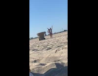 Two young girls swan pose trash bin