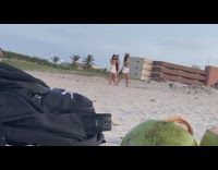 Three people dance video shoot beach music