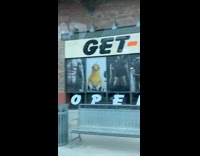 Get fit gym with yellow minion on window 