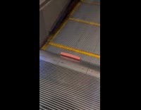 Hot dog roll at bottom of escalator
