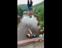 Green hat guy trampoline bridge brown water