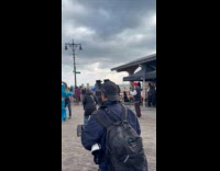 Elderly man wearing green and pink romper