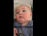 Baby in blue shirt says big tittie 