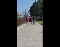 Two men in a king costume with churros