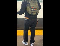 Guy dance with phone in gun belt