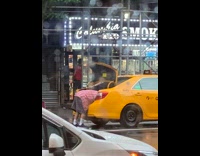 Collab WINY - Man bend over in trunk of yellow taxi cab