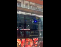 Woman dance with tour guide on bus