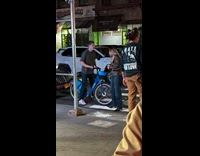 Guy helps girlfriend sit on bike basket part 1