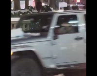 Guy wearing a christmas tree donates money 