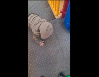 Kid slides down with leg folded 