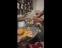 Man Eats Burger Meal in Common Room