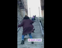 Group influencers dance climb famous joker stairs