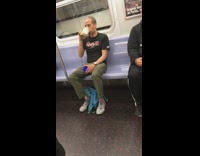Guy drinks peanut butter out of a jar on the subway