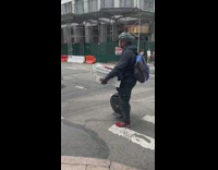 Guy delivers pizza while riding a hoverboard