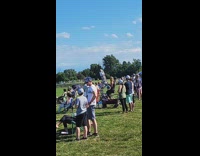 Woman exercises with stationary bike at football game