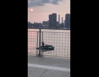 Two guys ride jet ski at river part 1