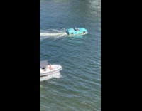 Boat looks like blue car sail on water