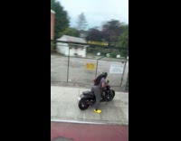 Man driving motorcycle onto sidewalk